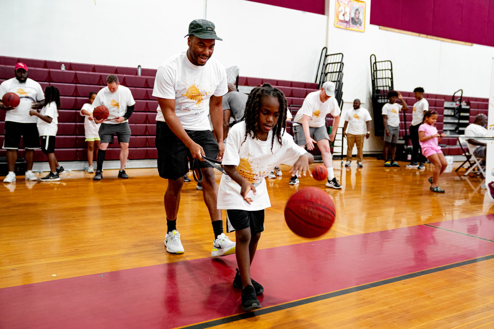 Kids dribbling at basketball clinic